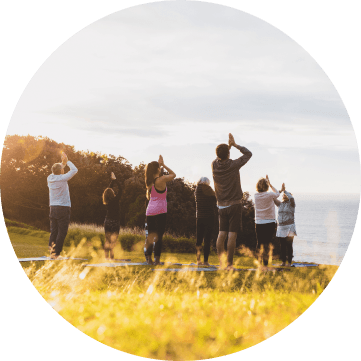 People doing yoga at outside